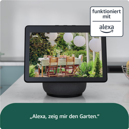 Schwarzer Smart-Display zeigt Gartenszene mit Blink Outdoor 4 Überwachungskamera Set